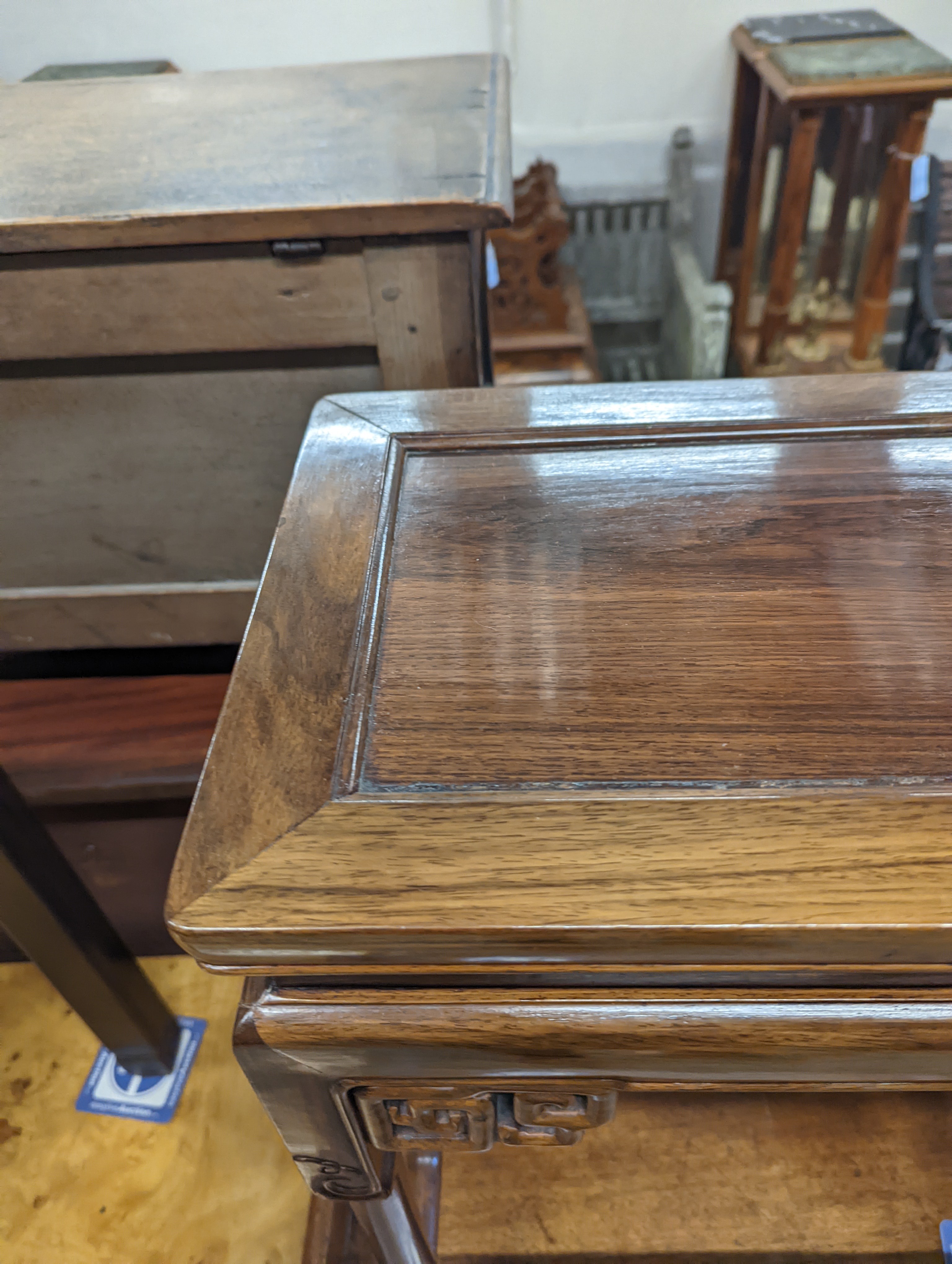 A nest of three Chinese rectangular tea tables, width 61cm, depth 36cm, height 66cm